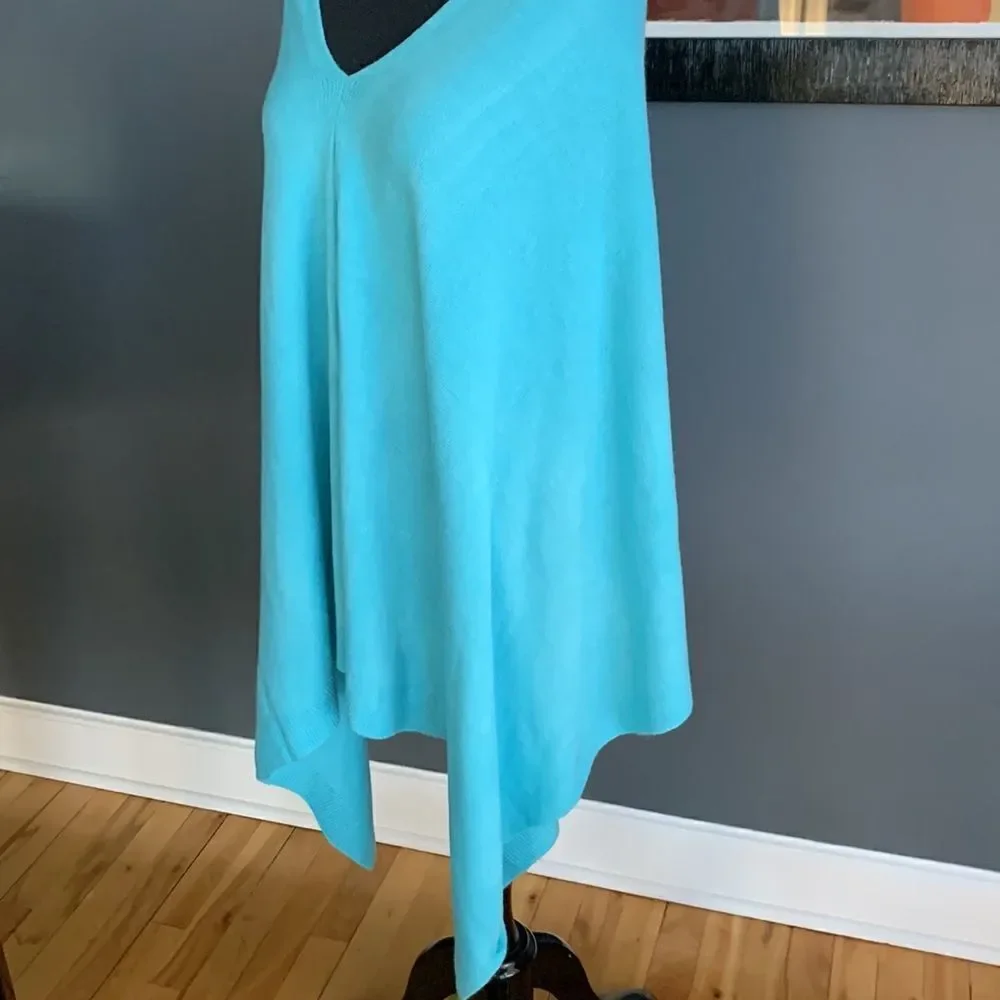 Soft turquoise V neck sweater cape. Asymmetrical front hem. NWT. one size.